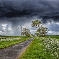 Buy canvas prints of Storm clouds over Ringstead by Gary Pearson