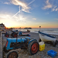 Buy canvas prints of Tractors at sunset Cromer beach by Gary Pearson
