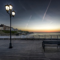 Buy canvas prints of Sunset bench Cromer pier by Gary Pearson