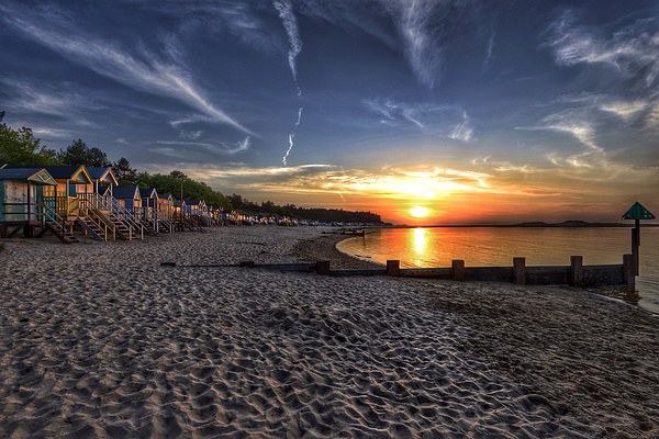 Wells beach hut sunset Picture Board by Gary Pearson