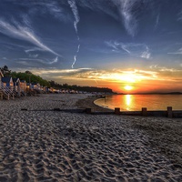 Buy canvas prints of Wells beach hut sunset by Gary Pearson