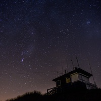 Buy canvas prints of Wells coast watch tower under the Milky Way  by Gary Pearson