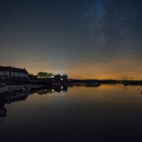 Buy canvas prints of Stars and the Milky Way over Burnham Overy Staithe by Gary Pearson