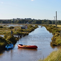 Buy canvas prints of  Paddling down the road - Brancaster Norfolk on th by Gary Pearson