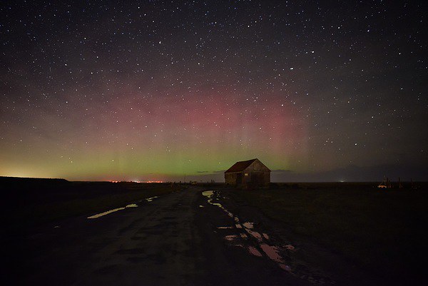 The Northern lights over the old coal barn at Thor Picture Board by Gary Pearson