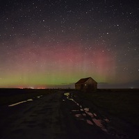 Buy canvas prints of The Northern lights over the old coal barn at Thor by Gary Pearson