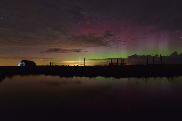 Northern lights over the old coal barn - Thornham, Picture Board by Gary Pearson