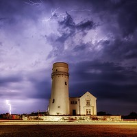 Buy canvas prints of Lightning over the old lighthouse  by Gary Pearson