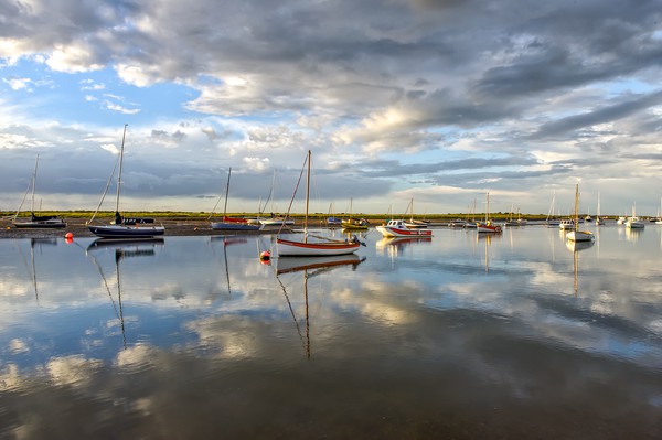 Reflections at Brancaster Staithe in Norfolk Picture Board by Gary Pearson