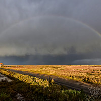 Buy canvas prints of A rainbow over the old coal barn at Thornham by Gary Pearson