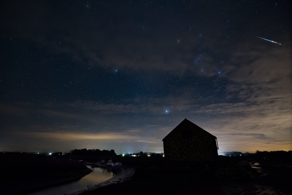 A bright Geminids meteor over the old coal barn Picture Board by Gary Pearson