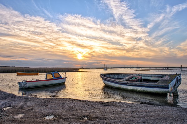 Sunset at Brancaster Staithe in Norfolk            Picture Board by Gary Pearson