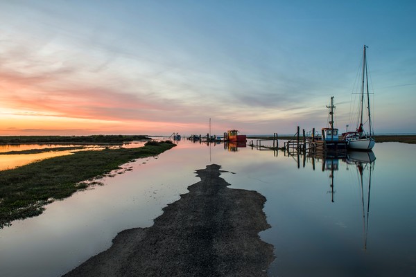 Sunset over Thornham harbour Picture Board by Gary Pearson