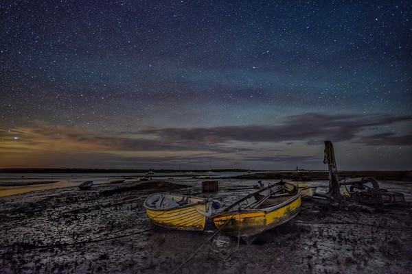 Waiting for the tide under the stars at Brancaster Picture Board by Gary Pearson