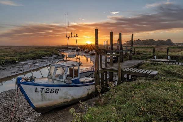 Sunrise in Autumn at Thornham Picture Board by Gary Pearson