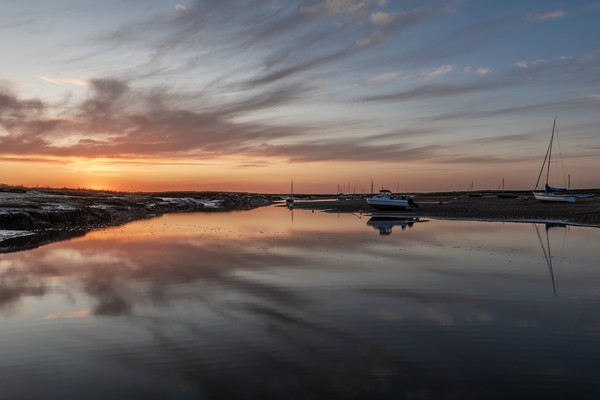 Sunset reflections at Brancaster Staithe  Picture Board by Gary Pearson