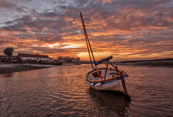 Sunset over Burnham Overy Staithe in Norfolk  Picture Board by Gary Pearson
