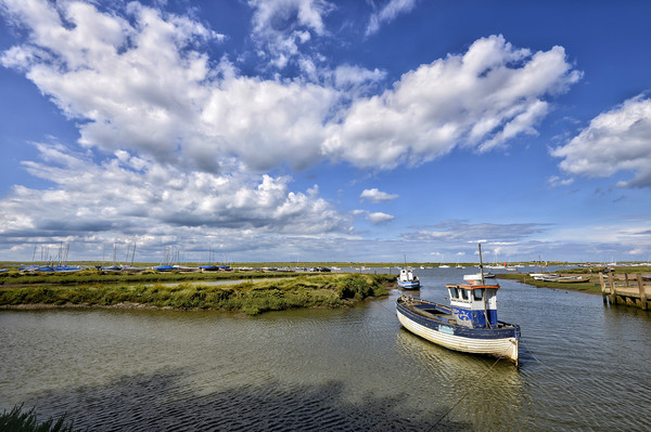 Brancaster Staithe harbour at high tide Picture Board by Gary Pearson