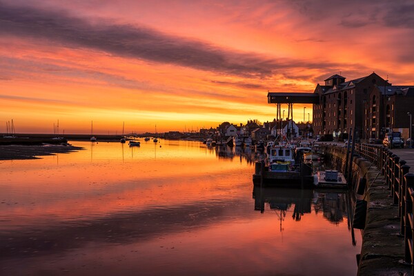 Sunrise over the granary at Wells Picture Board by Gary Pearson