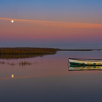 Buy canvas prints of A setting moon at Brancaster Staithe  by Gary Pearson