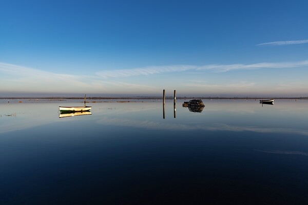 Reflections on a calm day at Brancaster Staithe  Picture Board by Gary Pearson