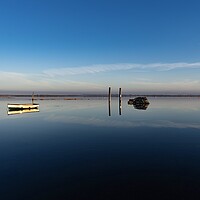 Buy canvas prints of Reflections on a calm day at Brancaster Staithe  by Gary Pearson