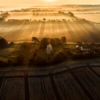 Buy canvas prints of A misty sunrise over St Mary’s Church, Titchwell  by Gary Pearson
