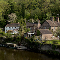 Buy canvas prints of Iron bridge farmhouse on the river by Kelly Astley