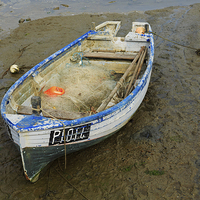 Buy canvas prints of Fishing dinghy at low tide by Louise Heusinkveld