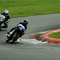 Buy canvas prints of Racing bikes at Snetterton racetrack by John Boekee