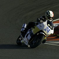 Buy canvas prints of Racing bikes at Snetterton racetrack  by John Boekee