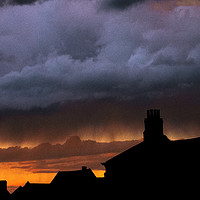 Buy canvas prints of Storm over Norwich with sunset by John Boekee