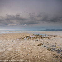 Buy canvas prints of Benllech Beach Approaching Shower by Angie Morton