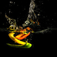 Buy canvas prints of A Splash of Peppers by Angie Morton
