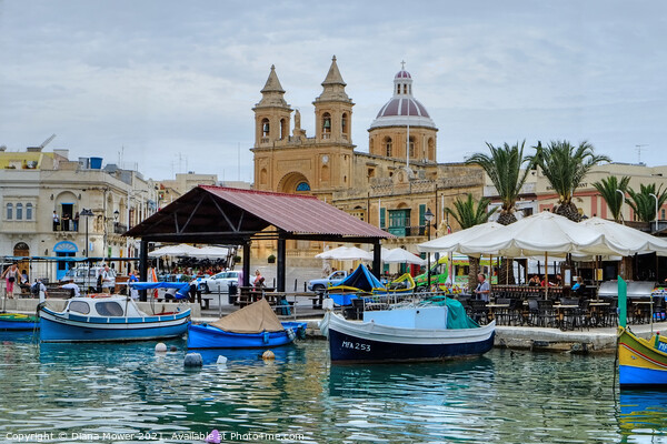 Marsaxlokk Harbour and town Picture Board by Diana Mower