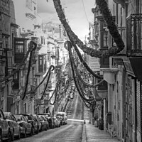 Buy canvas prints of Valletta Street Festival time monochrome by Diana Mower