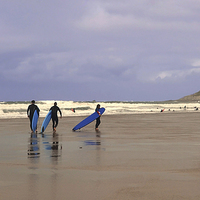 Buy canvas prints of Surfers at  Woolacombe beach, Devon by Diana Mower