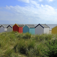 Buy canvas prints of Huts in the Dunes by Diana Mower