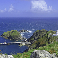 Buy canvas prints of Lundy harbour and lighthouse                       by Diana Mower