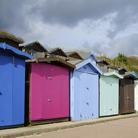 Buy canvas prints of  Frinton Beach Huts  by Diana Mower