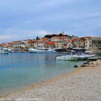 Buy canvas prints of Primosten Beach Croatia with view of the old town by Diana Mower