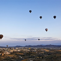 Buy canvas prints of Cappadocia landscape filled with hot air balloons by Arfabita  