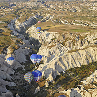 Buy canvas prints of Hot air balloons drifting through a Gorge by Arfabita  