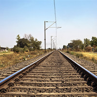 Buy canvas prints of Indian Railroad track with overhead cables by Arfabita  