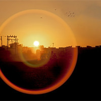 Buy canvas prints of Lens flare on Okha Sunset by Arfabita  