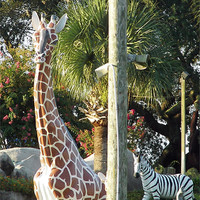Buy canvas prints of Giraffe and Zebra Statues by Susan Medeiros