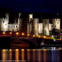 Buy canvas prints of Illuminated Conwy Castle: A Nighttime Spectacle by Mike Shields