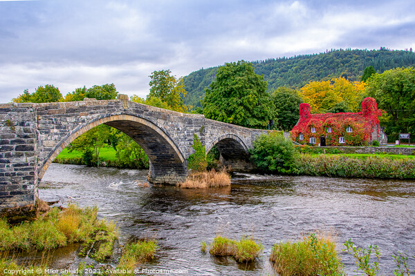 Llanrwst Stone Bridge and the  Tu Hwnt I'r Bont Tea Rooms. Picture Board by Mike Shields