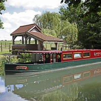 Buy canvas prints of CANAL BARGE LOUISE ON THE BASNGSTOKE CANAL by Anthony Kellaway