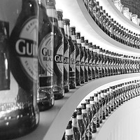 Buy canvas prints of GUINNESS BOTTLES by Anthony Kellaway